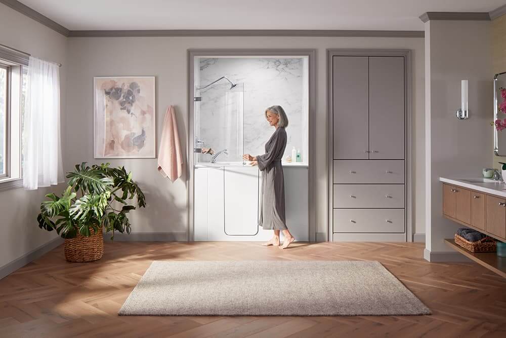 elderly woman entering a walk-in bath