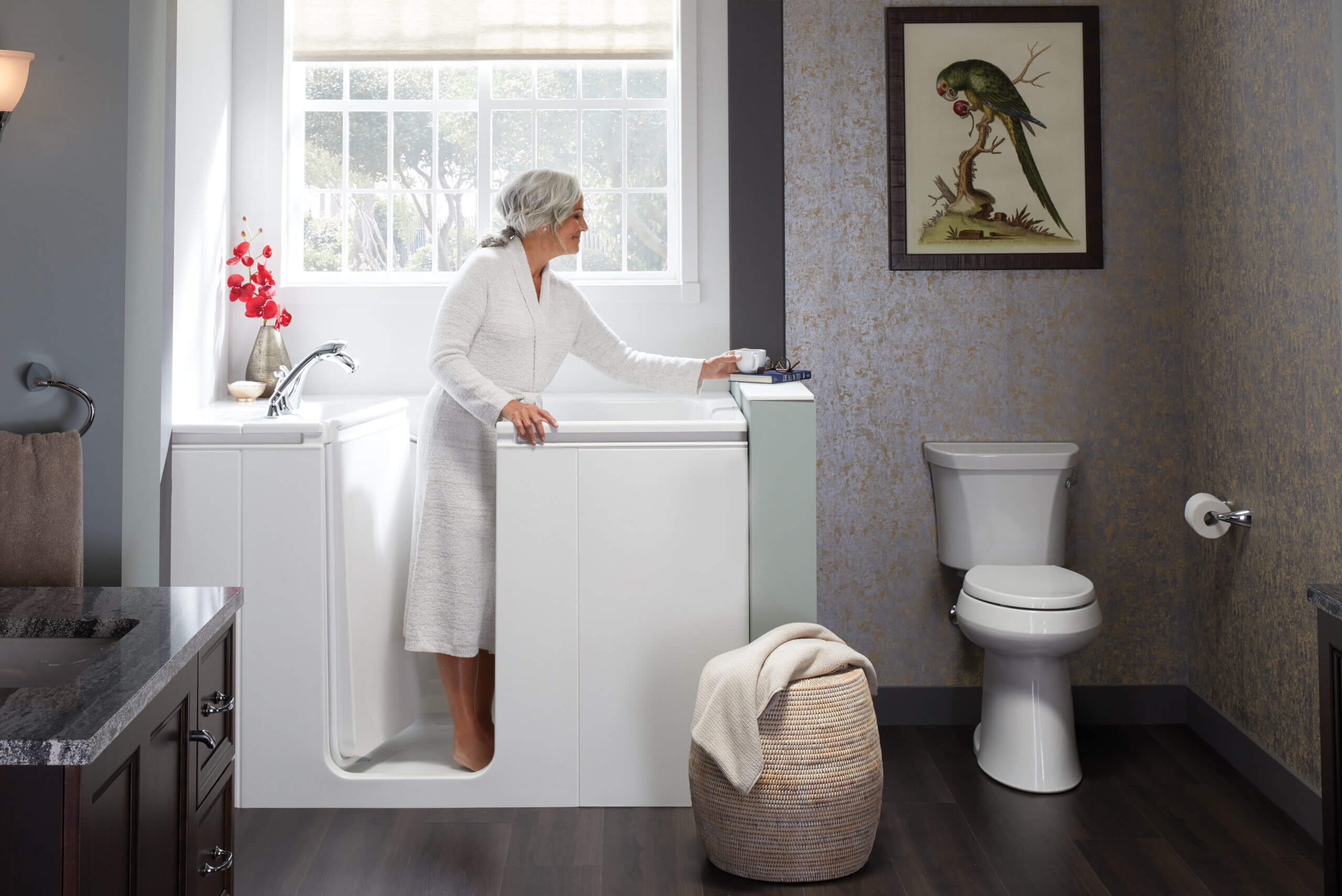 elderly woman standing in a walk-in bath
