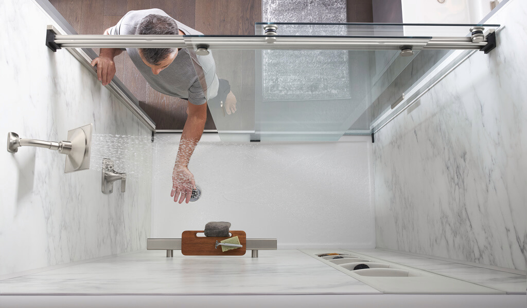 Man testing a low-flow showerhead