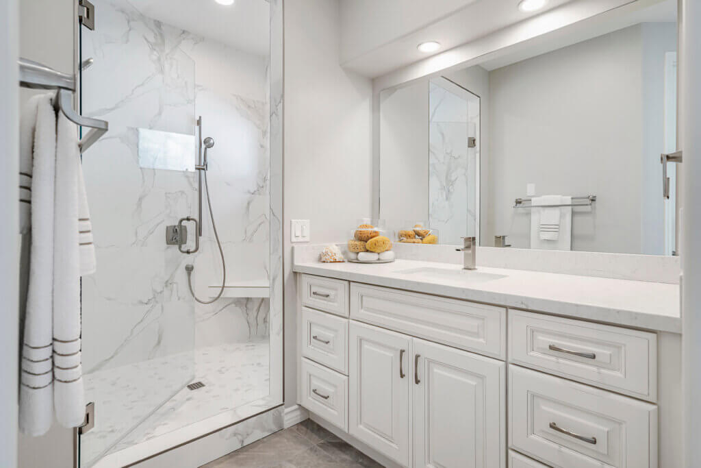 white modern bathroom with walk-in shower